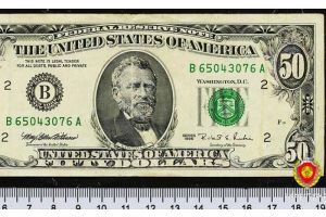 Жительница Минского района пыталась обменять в банке фальшивую купюру